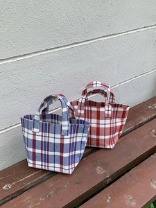 Colorful striped canvas tote bags in red and blue woven patterns for daily commuting