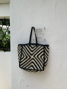 Detail of the black and white geometric crochet pattern on this large summer tote bag