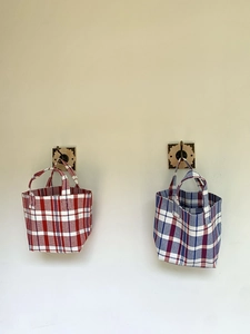 Close-up of durable woven PP plastic tote bags with classic colorful striped pattern
