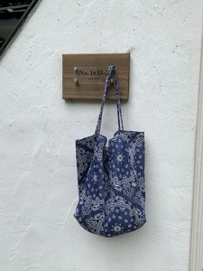 Retro dark blue paisley canvas tote bag for women showing a stylish shoulder bag design