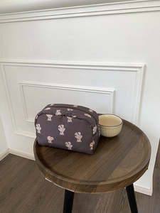 Detail of cute bear pattern on large capacity makeup bag made of durable fabric