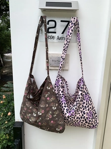 Set of two large canvas tote bags with leopard print and floral patterns in a casual style
