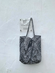 Grey paisley canvas tote bag with white floral pattern and matching shoulder straps