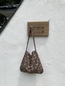 Detail of floral tote bag showing small pink and white flowers on cotton fabric