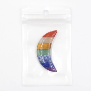 Detailed view of crescent moon chakra stone made from seven layered natural crystals