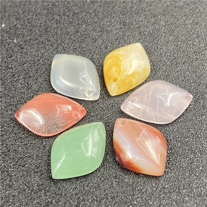 Detail of leaf-shaped agate and quartz stone beads with engraved veins for DIY jewelry
