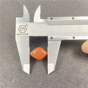 Orange carnelian rhombus bead measuring 17mm length with stainless steel caliper