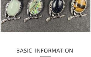 Close-up of owl pendants with aventurine, abalone shell, goldstone, and tiger eye stones