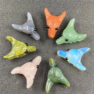 Multiple hand-carved fox head pendants in rose quartz, agate and tiger eye stone