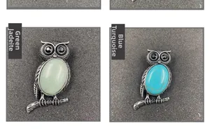 Detail view of retro owl brooches featuring green aventurine and blue turquoise stones