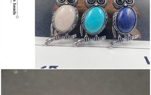 Detailed trio of vintage silver owl pendants with pink, turquoise, and blue natural stones