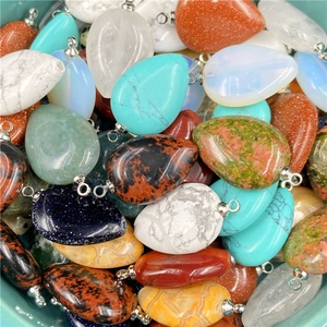 Mix of teardrop crystal pendants with silver loops for DIY jewelry making and necklaces