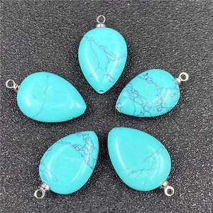 Detailed close-up of five turquoise teardrop pendants with black veins and silver bails
