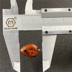 Mahogany obsidian teardrop pendant measuring 18mm with silver bail on black surface