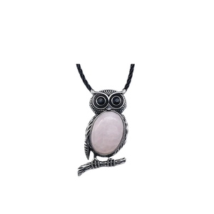 Retro owl pendant necklace with large pink oval gemstone and black woven rope chain