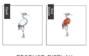 Detailed comparison of crane brooches featuring large oval opal and red agate gemstones