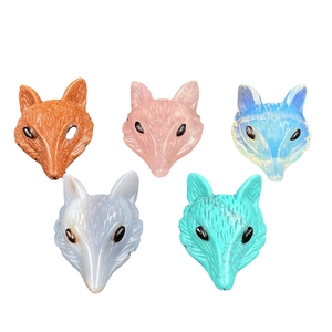 Five carved fox head pendants made of various gemstones including rose quartz and tiger eye
