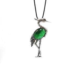 Vintage silver crane pendant necklace with large green gemstone and feather texture