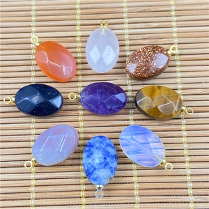 Detailed view of oval faceted natural stone pendants including agate and quartz for DIY jewelry