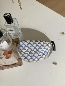 Detailed embroidery storage pouch with fish scale texture and metal carabiner clip