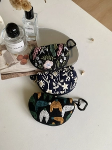 Detailed embroidery storage pouches with floral patterns and sturdy metal snap hooks