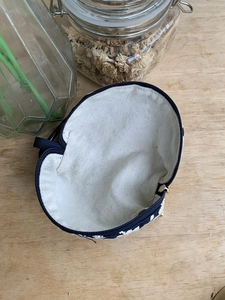 Navy canvas zip pouch with white floral embroidery for AirPods and small essentials