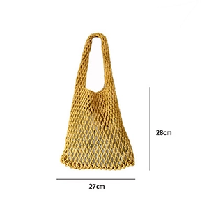 Detail of yellow handwoven mesh tote bag showing dimensions 28cm height and 27cm width