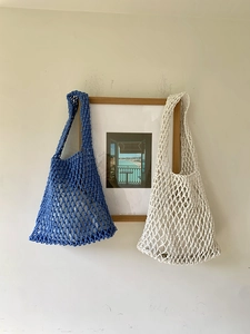 Handmade woven mesh tote bags in royal blue and beige colors with a minimalist hollow design