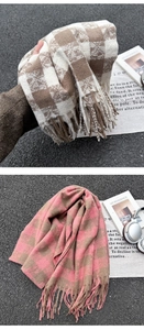 Close-up of winter plaid scarves with fringes in brown-white and pink-coffee patterns