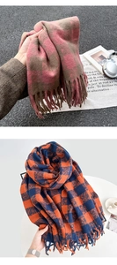 Detail of soft winter scarves with classic plaid patterns and elegant fringed edges