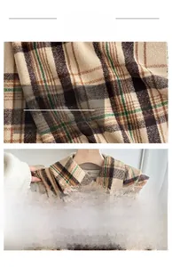 Macro texture of soft brown plaid scarf showing high-quality woven fabric and fringe detail