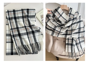 Detailed view of brown plaid scarf with tassels shown flat and styled on a beige coat
