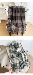 Close-up of thick plaid tassels on vintage brown and black checkered scarves