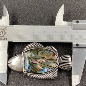 Fish pendant brooch with iridescent abalone shell inlay and vintage silver finish