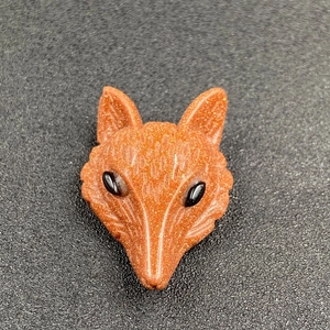Hand-carved fox head pendant made of shimmering orange goldstone for DIY jewelry