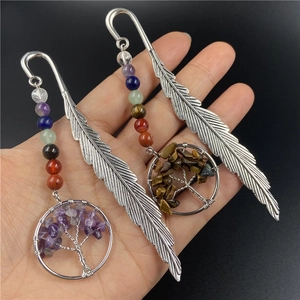 Silver feather metal bookmark with colorful chakra beads and tree of life pendant detail