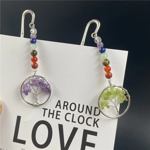 Detail of tree of life metal bookmarks with chakra beads and crystal pendants