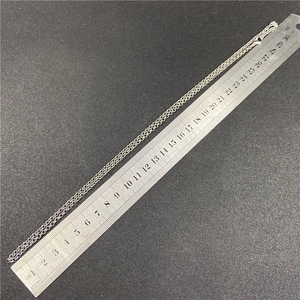Minimalist silver O-chain necklace 60cm length being measured on a ruler