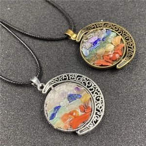 Detailed macro view of bohemian sun and moon pendants with colorful natural crystal stones