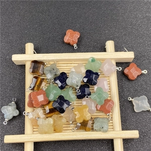 Assorted natural gemstone clover charms with metal rings for jewelry making and DIY crafts