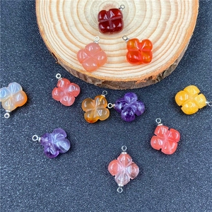 Handcrafted four-leaf clover crystal flower pendants in various natural stone colors