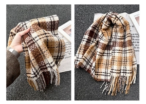 Detail view of retro plaid scarf with brown check pattern and soft fringe edges