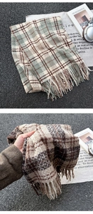 Close-up of thick plaid scarf with soft tassels and premium knitted texture for winter