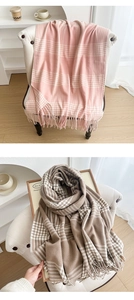Detail of thick plaid scarves with soft tassels in pink and brown vintage British style