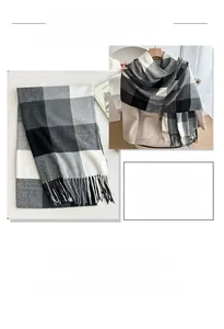 Detail of soft plaid scarf with classic checkered pattern and decorative tassels