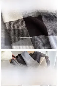 Detail of soft checkered scarf fabric showing coffee and grey plaid pattern texture
