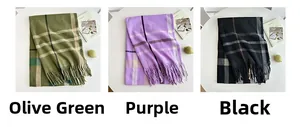 Detailed view of plaid scarves with tassels in olive green, purple, and black colors