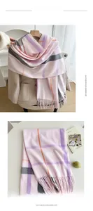 Detail of soft lilac and pink plaid imitation cashmere scarf with tassel edges