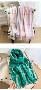 Detail of lilac and pink plaid imitation cashmere scarf with decorative fringe finish
