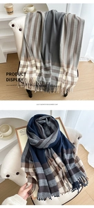Detailed close-up of checkered imitation cashmere scarf with soft fringe and plush texture
